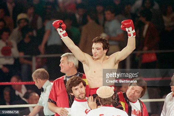Lightweight champion Ray "Boom Boom" Mancini is carried by his trainers after he knocked out Johnny Torres, of Homestead, FL, in their first round of...