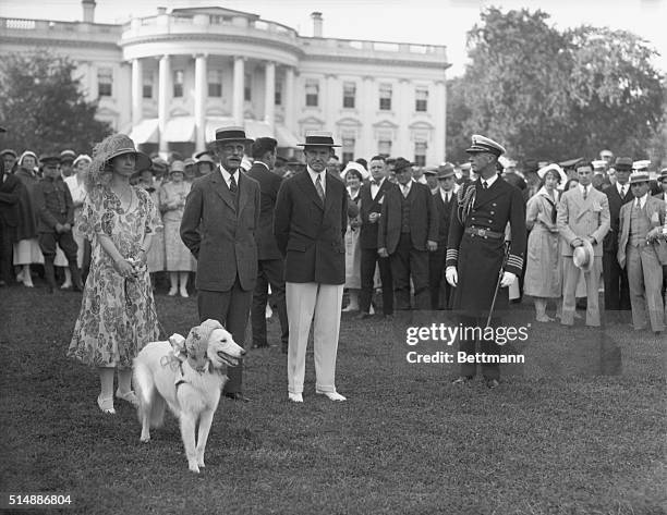 President and Mrs. Calvin Coolidge with Andrew Mellon and others on the White House lawn.