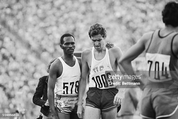 Kenya's Kipchoge Keino , winner of the fourth heat of the 1500 meter Olympic race for men, comforts his longtime foe, Jim Ryun of the U.S. After Ryun...