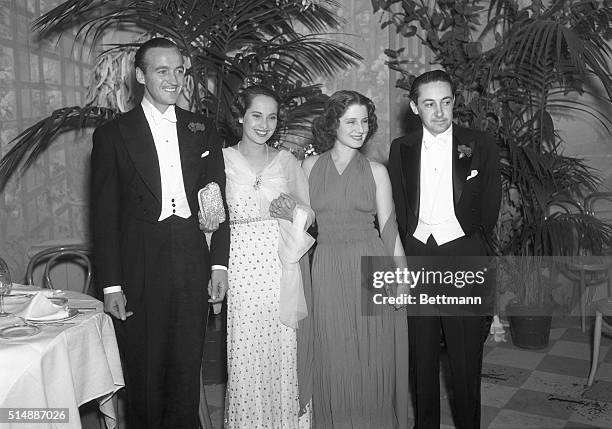 David Niven, Merle Oberon, Norma Shearer and Irving Thalberg , as they attended the Mayfair Ball in the Victor Hugo Cafe in Beverly Hills, Calif....