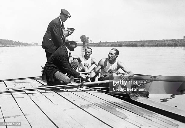 Jack Kelly and Paul Costello congratulated by Mr. Daby of the American Rowing Association and Coach Muller after victory in the Olympic Double Sculls.