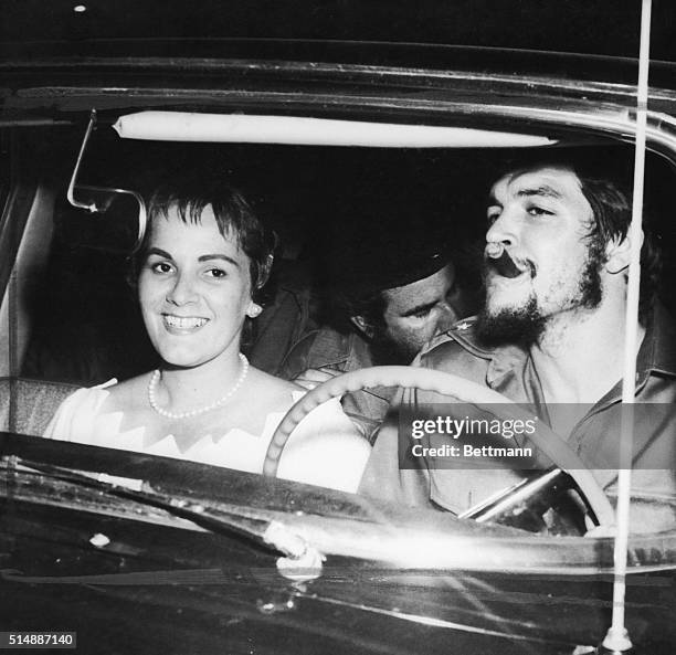 With a cigar clamped in his mouth, Cuban rebel Army Maj. Ernesto 'Che' Guevara drives from here June 3rd to begin his honeymoon with his bride, the...