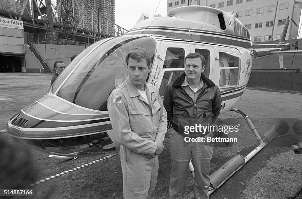Pilot H. Ross Perot Jr. And co-pilot Jay Coburn talk to reporters beside their helicopter, "The Spirit of Texas," in which they flew the first ever...
