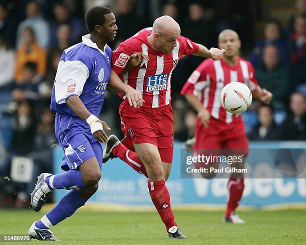 Paul Shaw of Sheffield United battles for the ball with Leon Johnson of Gillingham during the Coca-Cola Championship match between Gillingham and...