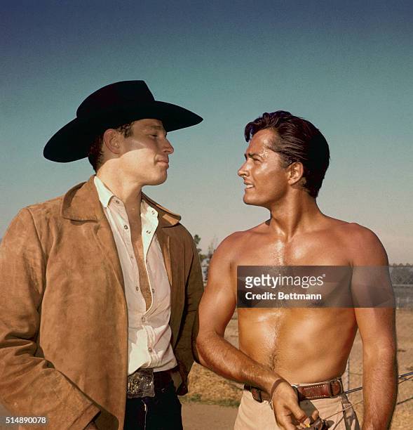 Charlton Heston and John Derek are seen here in a Western style television series or film.