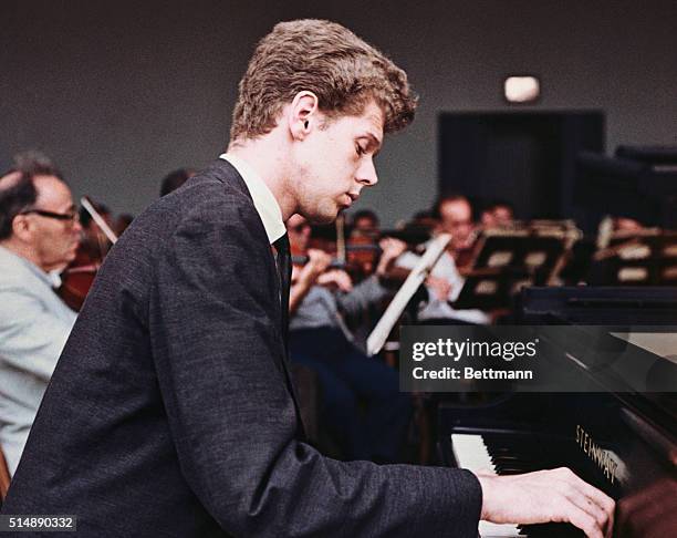 Classical musician Van Cliburn plays the piano.