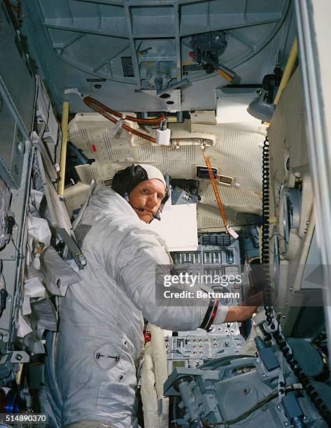 Neil A. Armstrong, commander for the Apollo 11 moon landing mission, practices for the historic event in a lunar Module simulatator in the Flight...