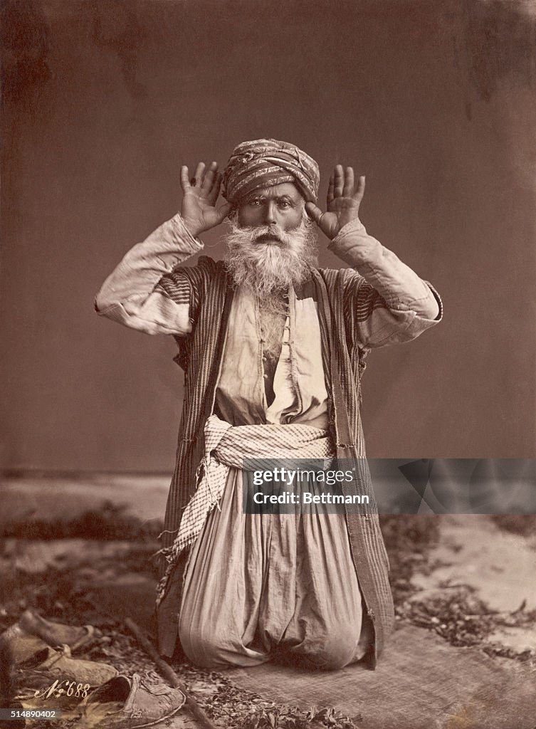 Muslim Man Poses in Prayer