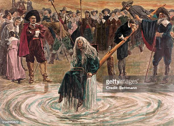 An accused witch going through the judgement trial, where she is dunked in water to prove her guilt of practicing witchcraft.