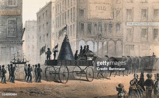 Procession, including a wagon carrying a section of a cable connection, celebrating the inauguration of the first Transatlantic cable in 1858 in New...