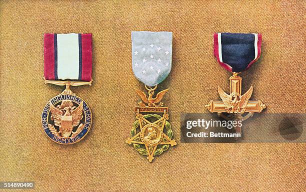 American war decorations, left to right: Distinguished Service Medal, Congressional Medal of Honor, and Distinguished Service Cross.