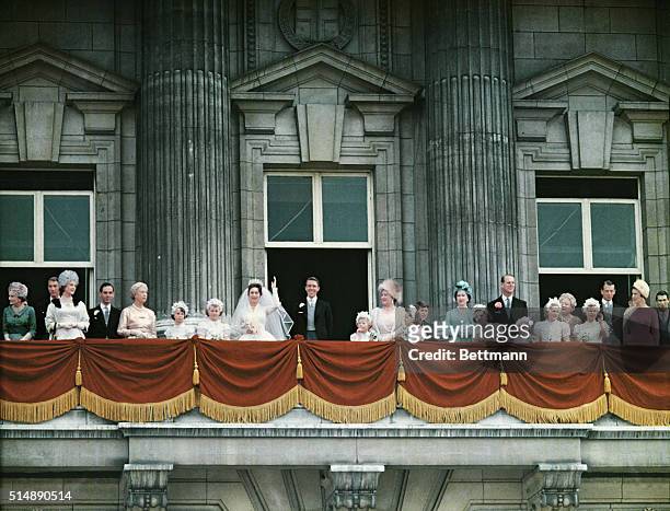 London, England: Princess Margaret and Antony, the earl of Snowden, wave from the balcony of Buckingham Palace preceding their wedding, flanked by...