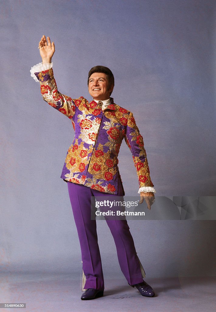 Liberace Ruffle Full length photo of singer and entertainer Liberace, , posing with ...