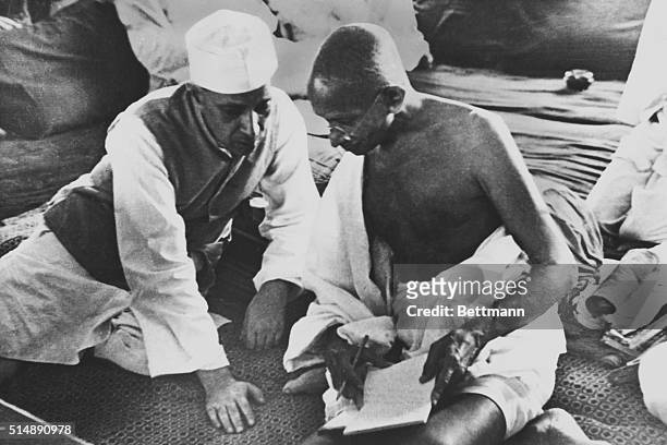 India: Mahatma Gandhi and Pandit Jawaharlal Nehru during the All India Conference Committee Session when the "Quit India" Resolution was adopted.