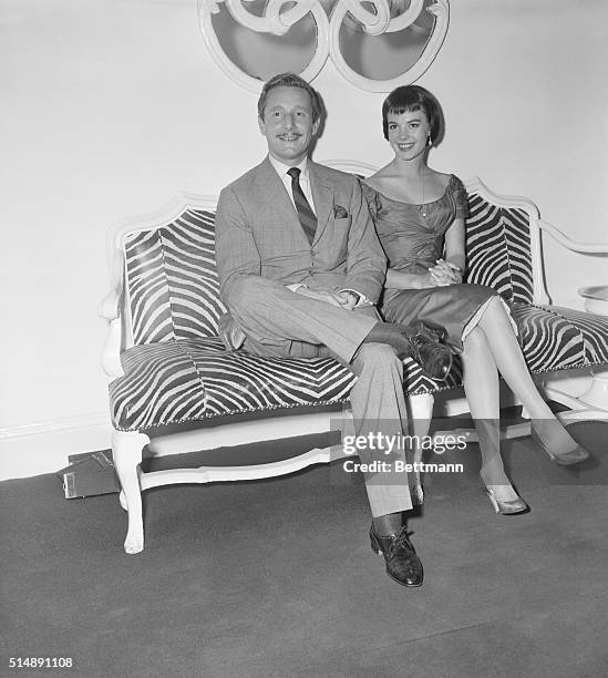 The El Morocco Club, New York City: Fashion designer, Oleg Cassini with actress Natalie Wood, sitting on an El Morocco style zebra lounge chair.