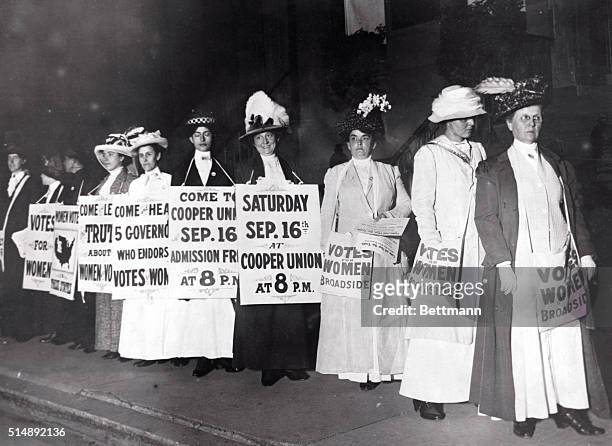 New York: New York Society Woman Suffragettes as sandwich men advertise a mass meeting to be addressed by the Governor of the Suffrage states....