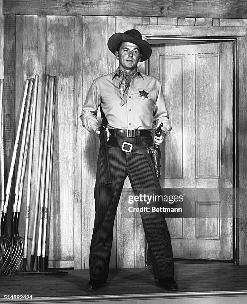 Ronald Reagan is shown as a frontier marshall in the movie "Law and Order," released in 1953.