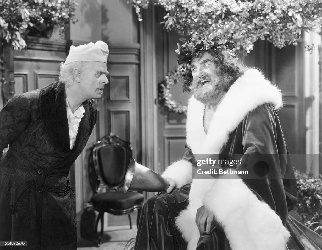 Ebenezer Scrooge and the Spirit of Christmas Present