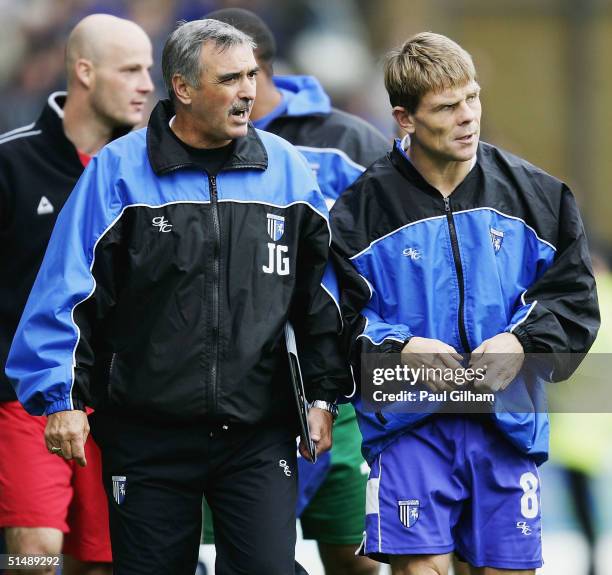 Manager Andy Hessenthaler of Gillingham talks to his assistant John Gorman after their defeat during the Coca-Cola Championship match between...