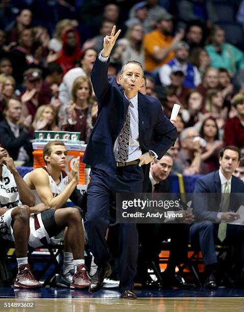 Billy Kennedy the head coach of the Texas A&M Aggies gives instructions to his team in the game against the Florida Gators during the quarterfinals...