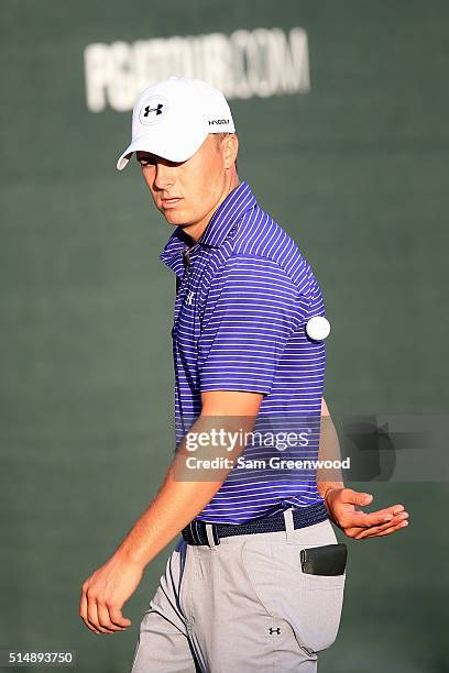 Jordan Spieth tosses a ball at the end of his round on the 18th green during the second round of the Valspar Championship at Innisbrook Resort...