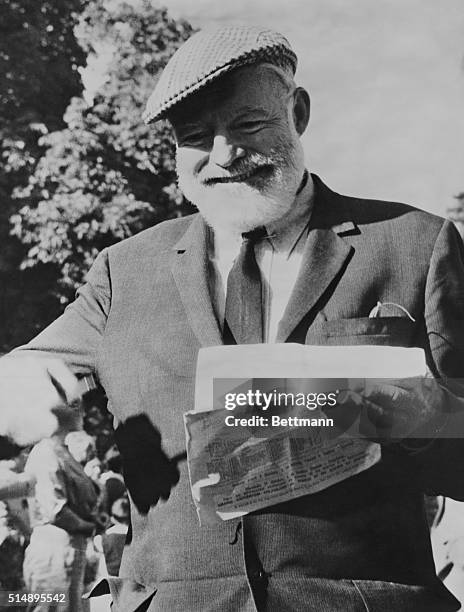 Ernest Hemingway at Longchamp for the Prix de l'Arc de Triomphe trying to pick a winner.