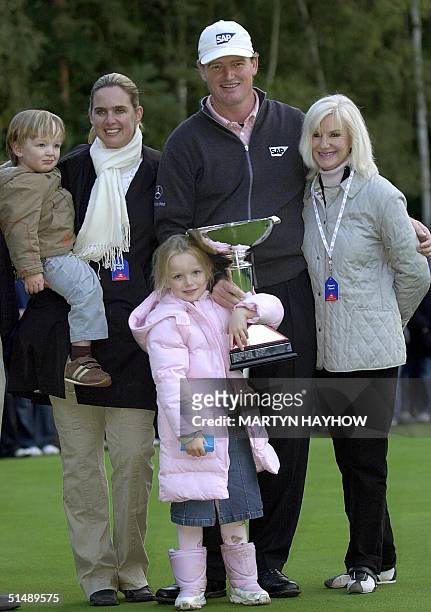 South African Ernie Els poses with his wife Liesl daughter Samantha and son Ben, and Mother Hettie, after winning the World Match Play at Wentworth...