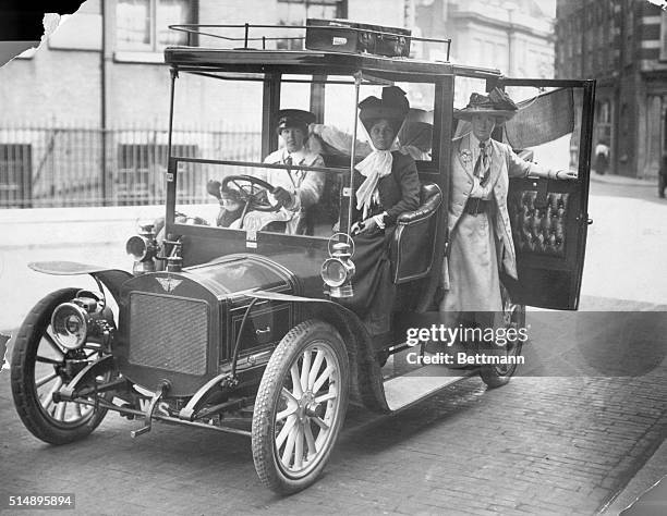 England: Mrs. Pankhurst has just left London accompanied by Miss Christopher St. John and Miss Craig, daughter of Ellen Terry. The car is driven by...