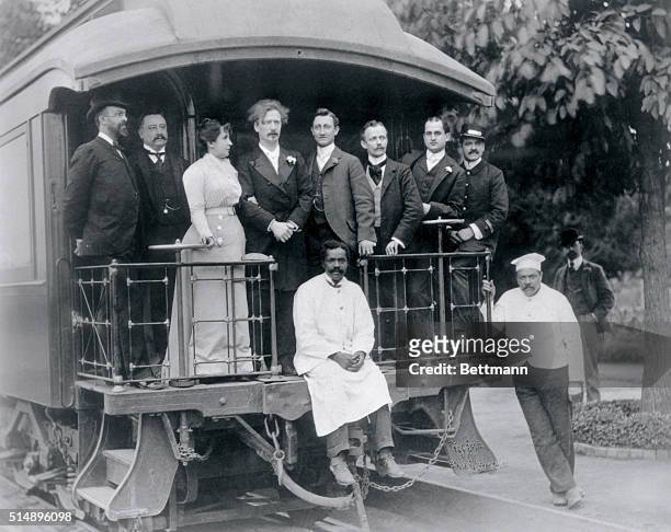 Mr. And Mrs. Ignar Paderewsky and staff on rear platform of private railroad car used during his tour through America in 1900. Photograph.
