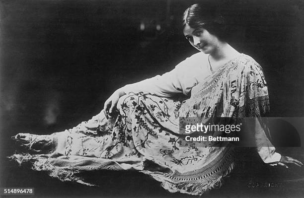 Isadora Duncan sitting down.
