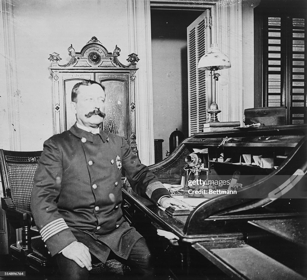 New York Police Captain Sitting at Desk