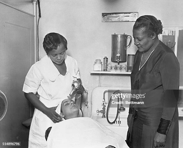 Harlem, New York: A'Lelia Walker is shown supervising a facial in one of Madam C.J. Walker's many beauty parlors.