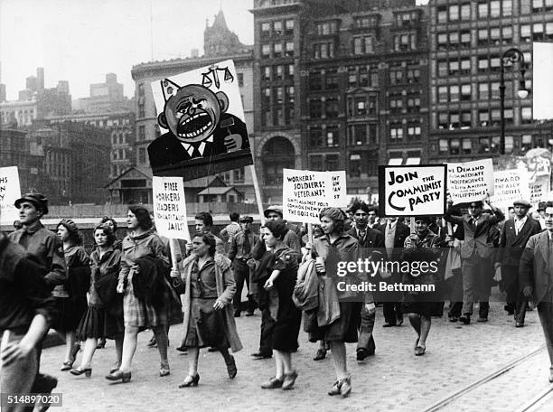 Marchers carrying signs during a Communist rally in New York City.