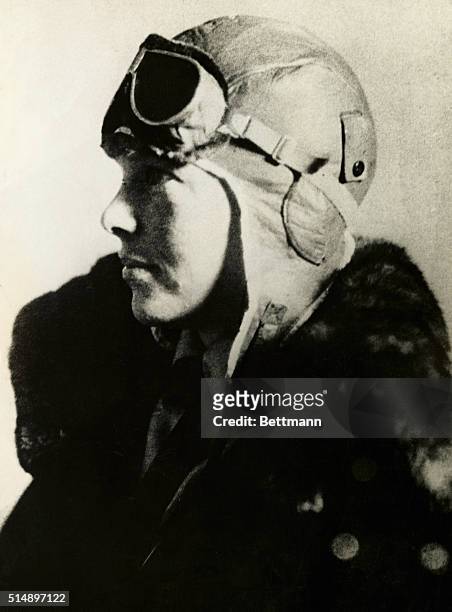 Pilot Amelia Earhart wearing a leather flight helmet and goggles.