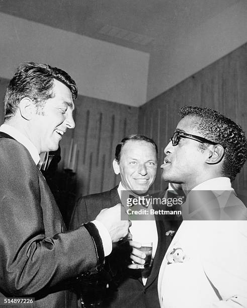 Left to right are Dean Martin, Frank Sinatra, and Sammy Davis Jr., at the Cedars of Lebanon charity dinner, 8th July 1961. Sammy's bosom pals are...