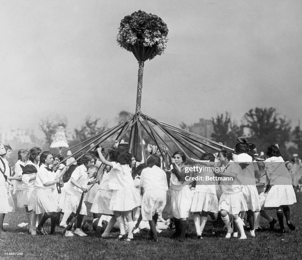 Schoolgirls Dancing Around Maypole