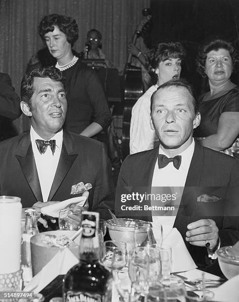 Candid Hollywood...Two solid crooners: Dean Martin and Frank Sinatra show off their sartorial splendor - down to what looks to us like paisley...