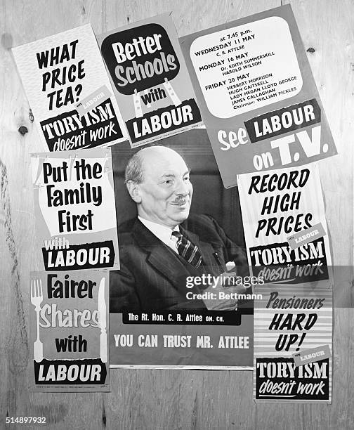 Be-Labouring the Point. London, England: A poster portrait of former Prime Minister Clement Attlee is framed by some of the other placards the Labour...