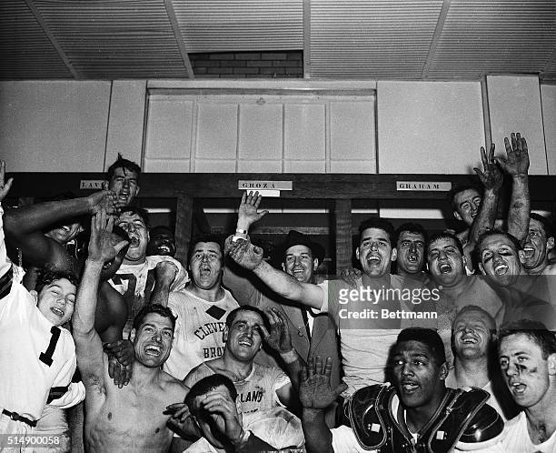 The Cleveland Browns show their glee in the dressing room after trouncing the Detroit Lions, 56-10 in the National League professional football...