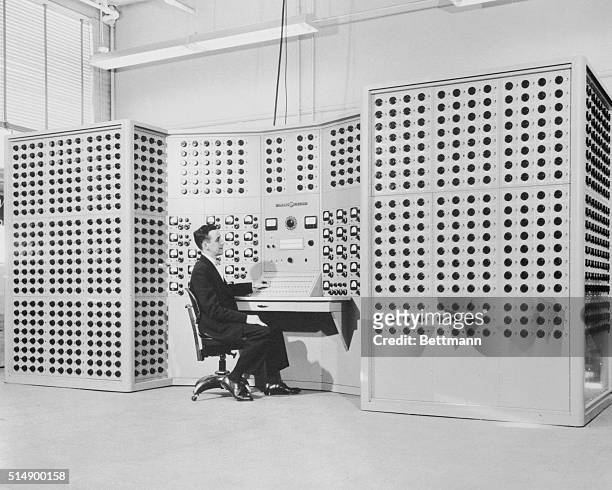 Huge dial-studded computer that mathematically models a complex electric power system is given its first test run by K.R Geiser, General Electric...
