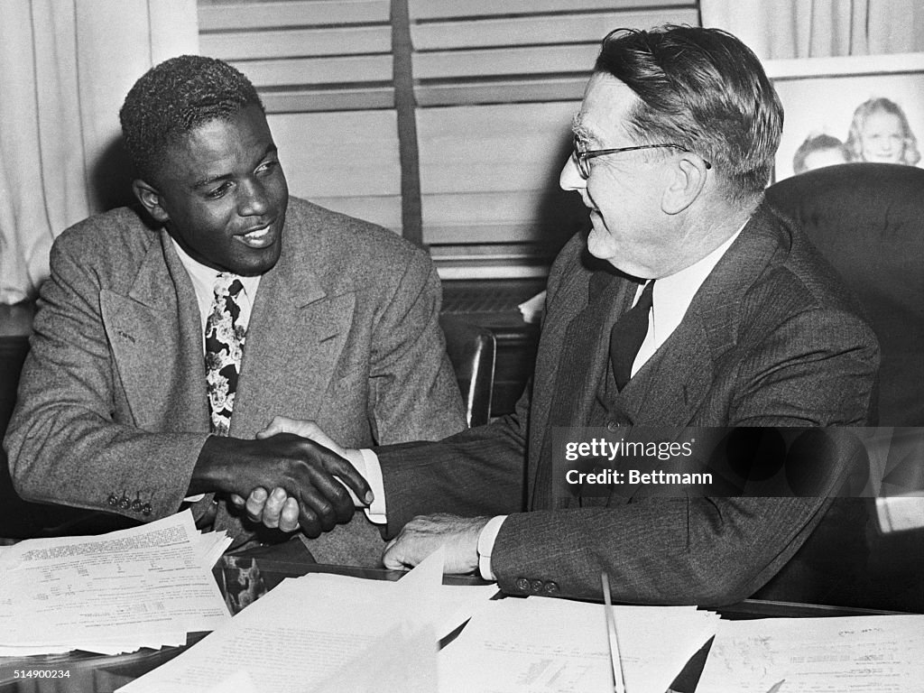 Jackie Robinson Shaking Branch Rickey's Hand