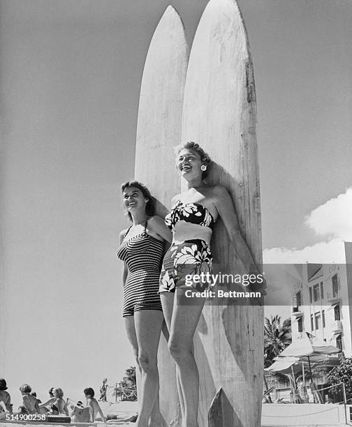 All set to do some surfboarding at Honolulu's Waikiki Beach are Mary Ray Fearon and Oralee Kiewit. The sun couldn't have found a prettier pair to...