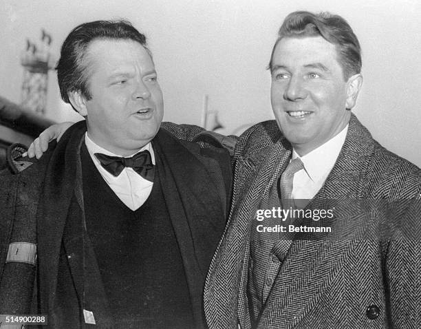 Going their separate ways, actor-director Orson Welles and actor Michael Redgrave bid fond farewell at the London Airport. Welles was on his way to...