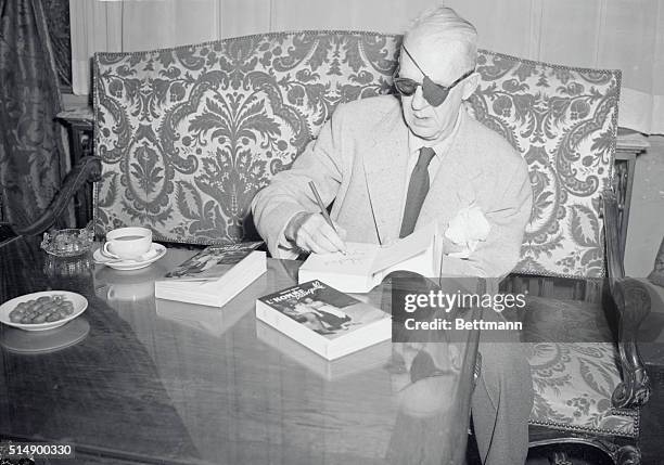 John Ford, the American Director and Producer, autographs a French Edition of The Quiet Man, the story that he made into such a successful movie. The...