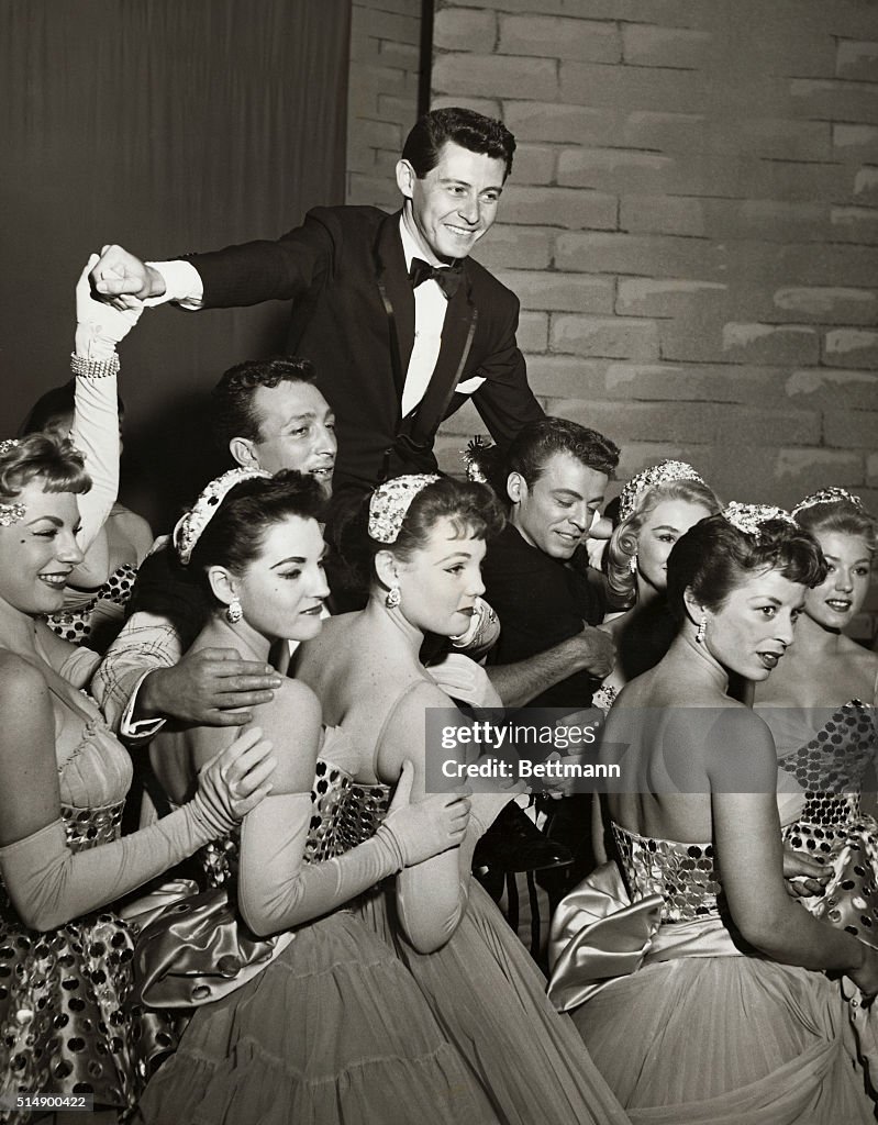 Eddie Fisher on Shoulders of Cast Members