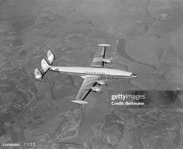 Burbank, California: Here is the first four engine transport for Germany's newly reborn Lufthansa World Airline. It is being flown to Hamburg by two...
