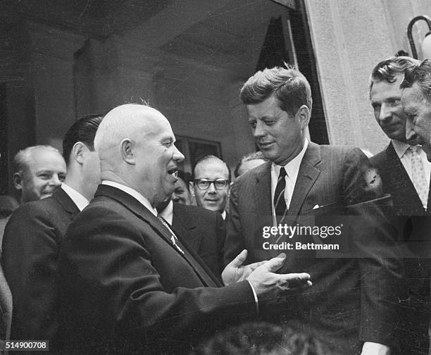 John Kennedy and Nikita Khrushchev chat amiably outside the Soviet Embassy in Vienna after a seemingly successful summit meeting.