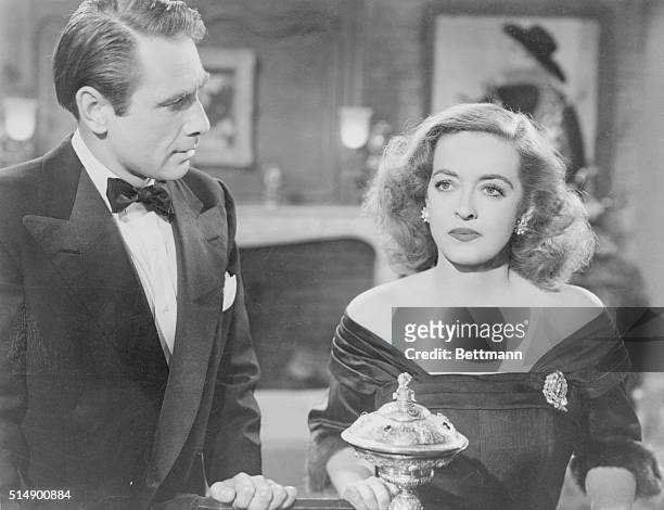 Real-life husband and wife Gary Merrill, as Bill Sampson, and Bette Davis, as Margo Channing, co-star in All About Eve.