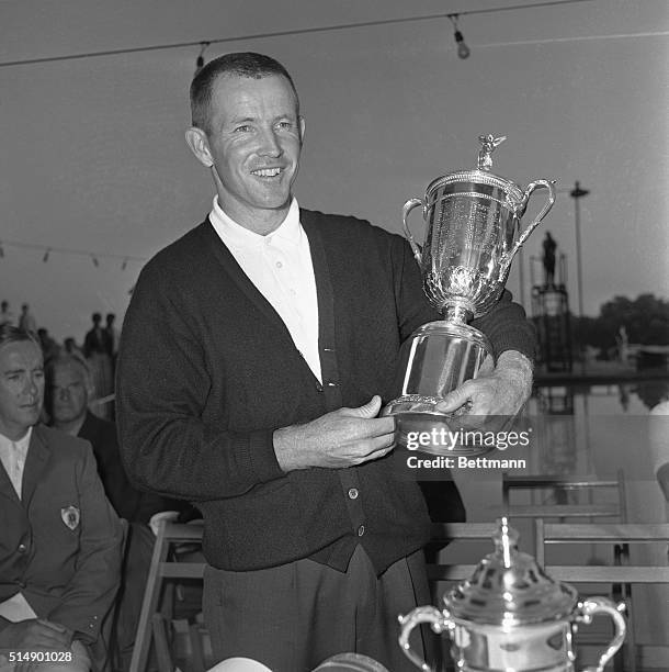 Golfer Gene Littler receives the US Open Championship cup at Oakland Hills here 6/17. Littler's final score was 281 for 72 holes.