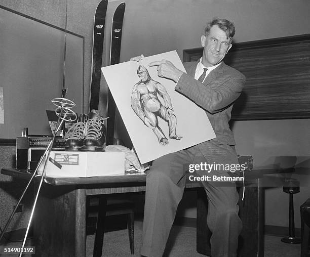 Sir Edmund Hillary, conqueror of Mount Everest, shows newsmen here 1/27 of an Abominable Snowman, which he hoped to capture on the next expedition to...